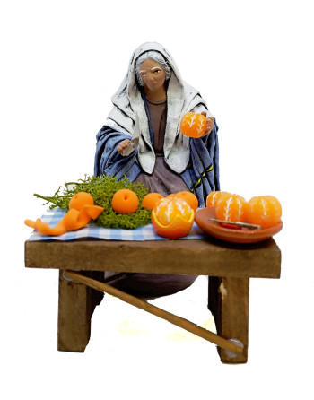 Pastora pelando naranjas....