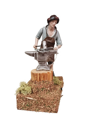 Herrero con motor barro...