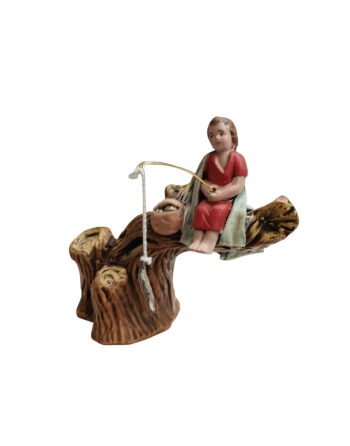 Niño pescando para el belén